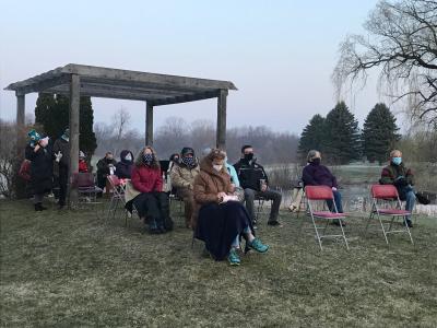 people seated by gazebo