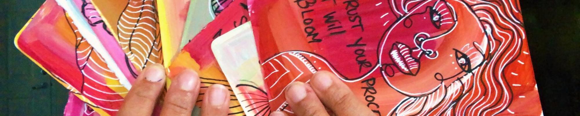 hands holding soulful cards