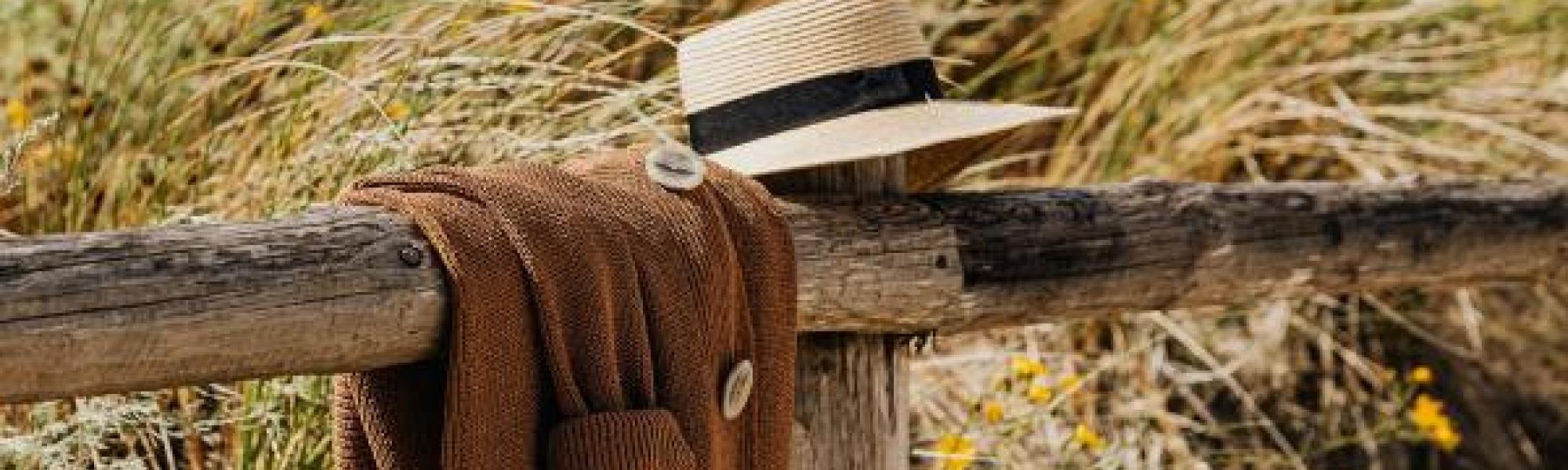 hat on fence rail